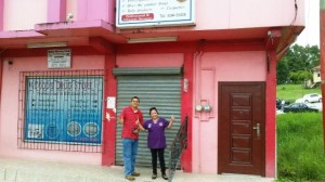 Hector and Daisy in front of Codds Pharmacy also honoring the Ladies