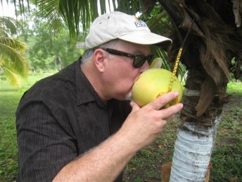 Arizona Expat cooling off with fresh coconut water in Belize