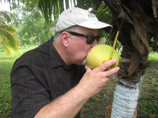 Arizona Expat cooling off with fresh coconut water in Belize